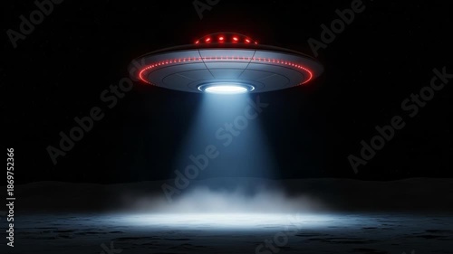 UFO hovers in night sky with bright beam landing on ground - 4k video