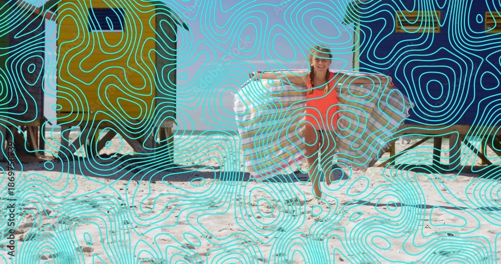 Fototapeta premium Holding ring, girl kneeling on sand at beach, wearing orange-suit and straw-hat, huts, aqua-overlay