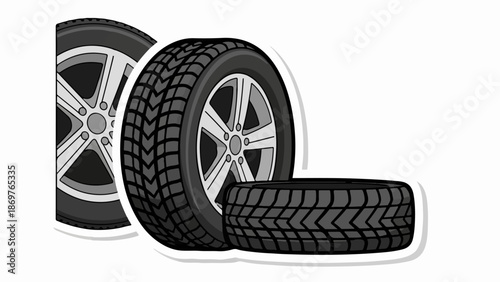 Three gray tires and rims, one lying flat, on a white background