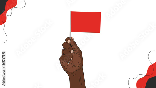 Dark skinned hand holds a small plain red flag against a white background decorated with abstract black and red flowing shapes.
