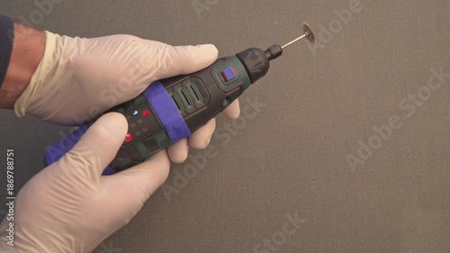 Changing Speed Settings on Cordless Rotary Tool with Polishing Bit. Sound of Cordless Rotary Tool Motor at Varying Speeds