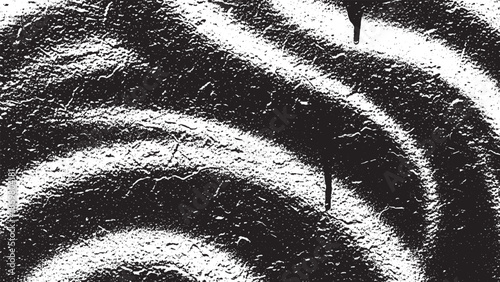 Abstract Spiral Pattern with Textured Surface and Dark Splatters.