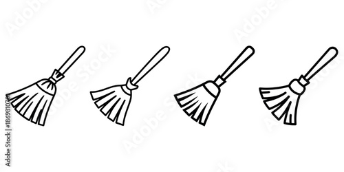 Assortment of stylized brooms with straw bristles and long handles for cleaning or magic