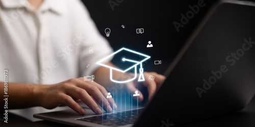 Online Education: A person working on the laptop in pursuit of knowledge and academic achievement, symbolizing the growing trend of remote learning and digital education