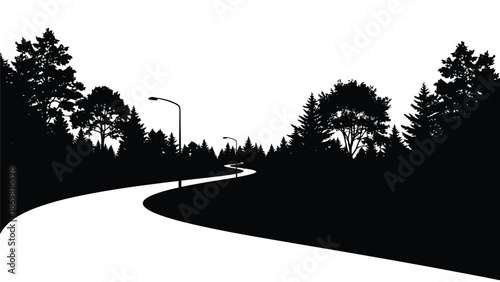 A winding road leads through a silhouetted forest landscape