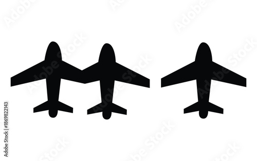 Simple black silhouette icons representing three commercial passenger airplanes flying above on a white background