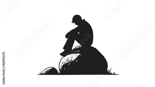 Silhouette of a Man Sitting on Rock.