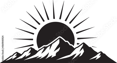 Black and white mountain landscape with sun rising behind peaks sunrise