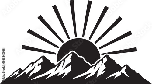 Black and white mountain range with sun rising behind sunrise silhouette