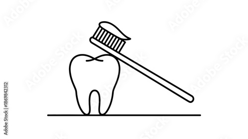 Promoting good oral hygiene: a toothbrush with toothpaste resting on a healthy tooth