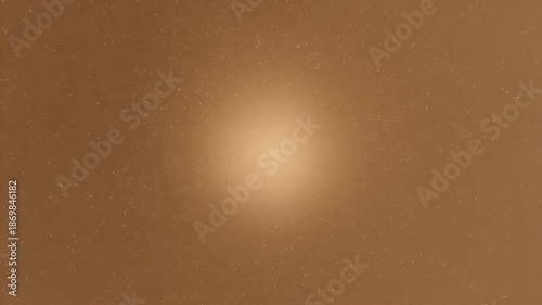 Golden particles floating around bright light