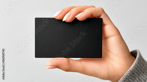 Black hand holding an empty...