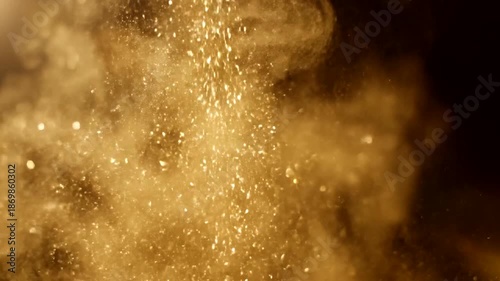 Golden Dust Particles Falling in Dark Background.