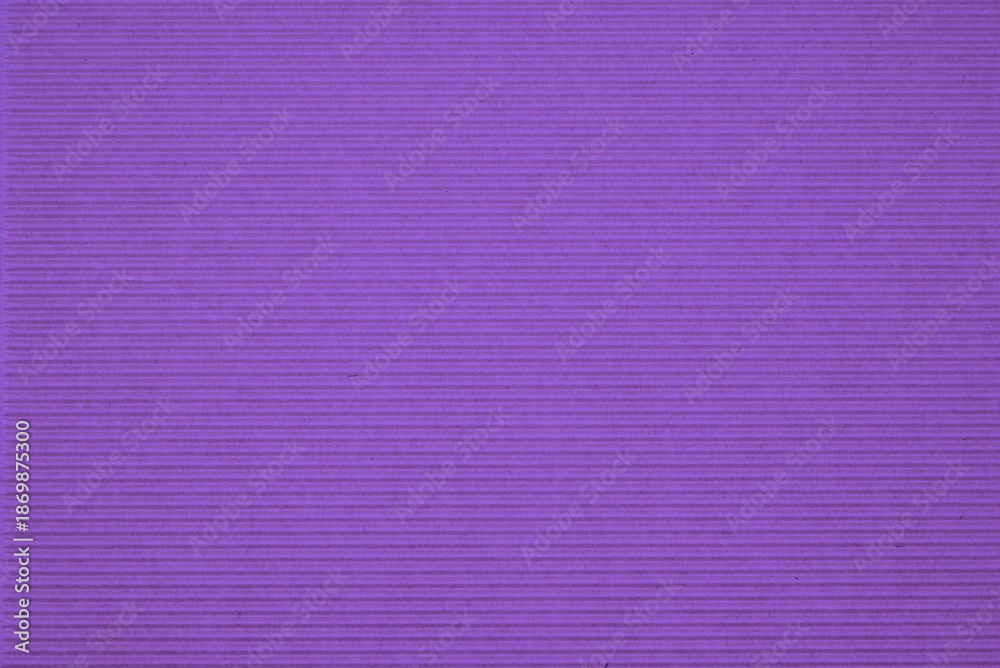 Fototapeta premium Corrugated cardboard background with purple texture. Minimal recycled paper surface for eco design, packaging, craft projects, sustainability concepts and copy space.
