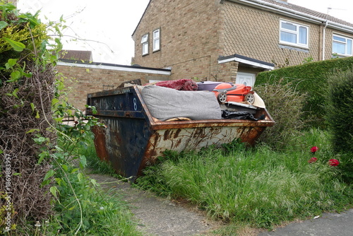 Rubbish Skip in a Garden