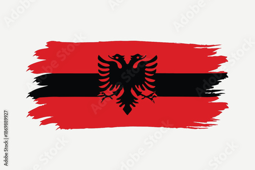 albania flag with red black brush paint strokes and eagle