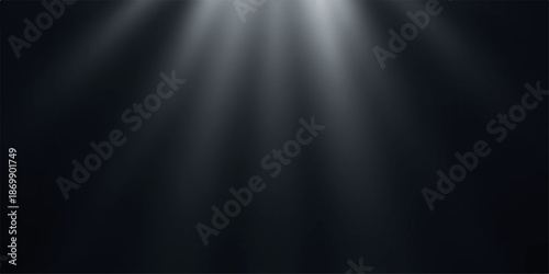 Beam of light shining through darkness with rays of illumination