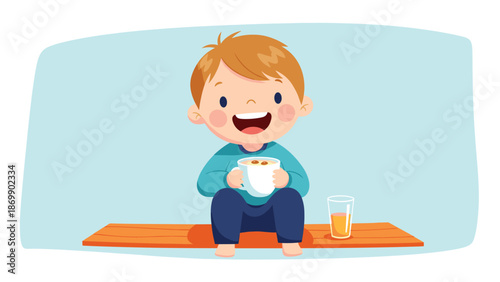 Happy young boy sitting on an orange mat holding a cup of hot chocolate with a glass of juice nearby in a blue room.