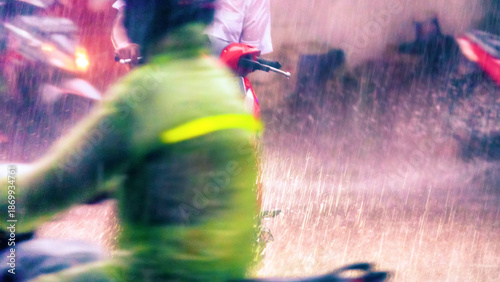 Canvas Print Traffic on the streets of the city (street bike, scooters and cars) during the tropical downpour, monsoon season
