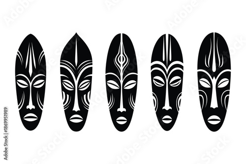 Set of stylized black tribal African mask silhouettes