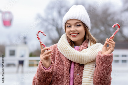 Young woman with candy cane...