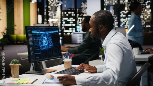 Fotografie Black man analyst uses AI neural networks for data mining and optimization, working in a multinational company with automation tools