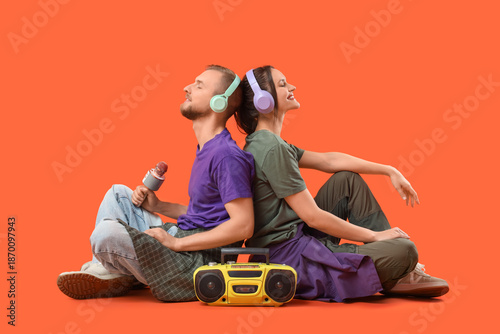 Young couple in headphones ...