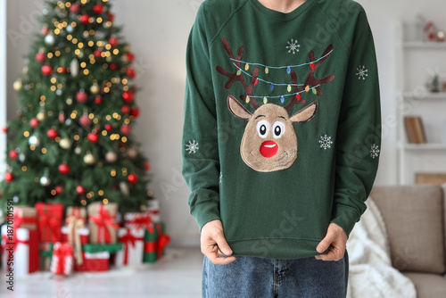 Young man in Christmas swea...