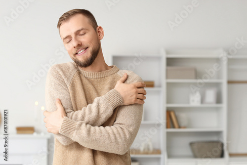 Young man in beige sweater ...