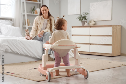 Cute little baby girl using...