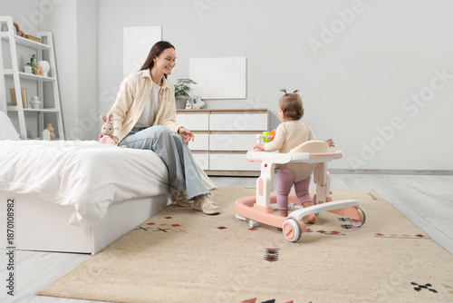 Cute little baby girl using...
