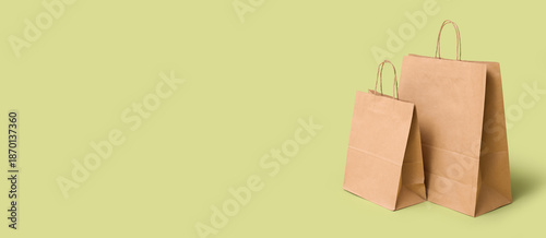 Paper shopping bags on gree...