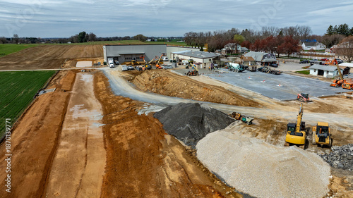 Canvas Print Heavy machinery operates on a construction site near a rural location
