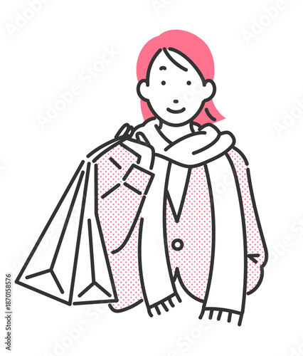 買い物袋を下げている冬物コーデの女性