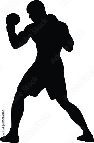Silhouette of a male boxer in an aggressive fighting stance wearing boxing gloves ready to compete