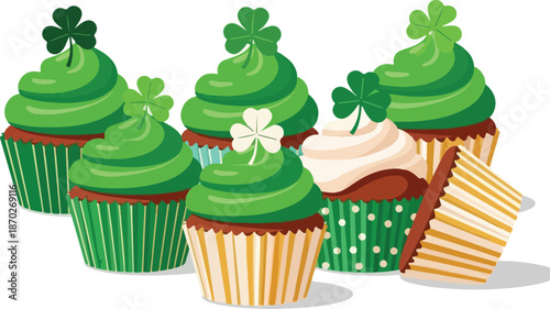 Assorted cupcakes with green frosting and shamrock decorations on a white background