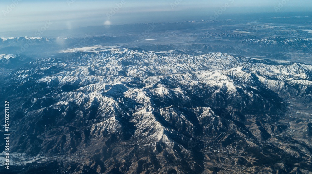 Fototapeta premium aerial view of mountains in the snow
