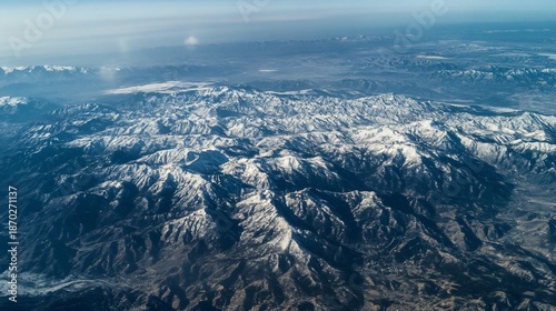 aerial view of mountains in the snow