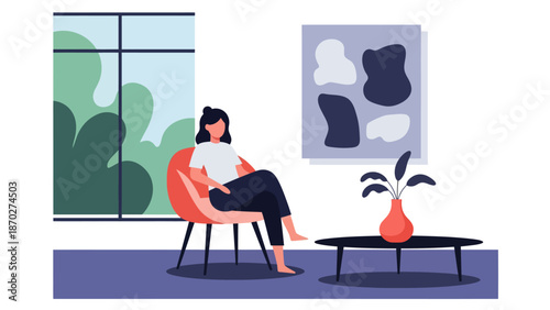 Woman sitting comfortably in a modern armchair indoors.