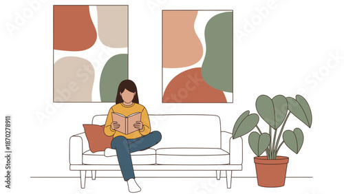 Young woman enjoying a quiet moment, engrossed in reading a book while relaxing on a comfortable sofa.
