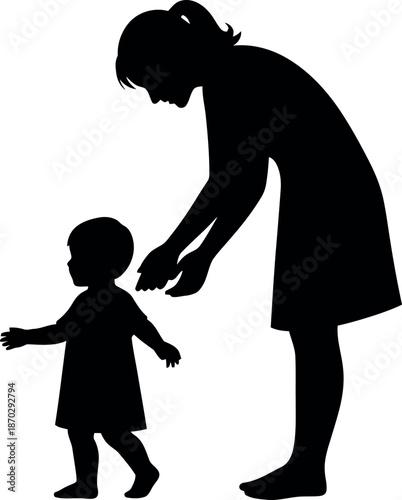 A woman helping a toddler walk