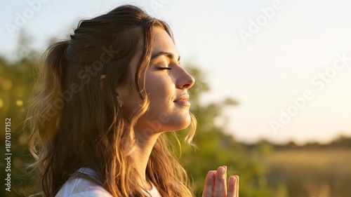 Young woman taking deep mindful breath practicing wellness outdoor