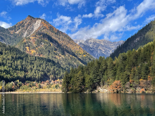 Beautiful scenery of Mirror Lake at Jiuzaigou national park, Sichuan China in autumn season. Famous travelling destination 