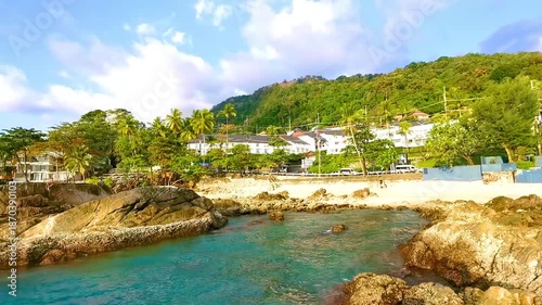 Kalim Beach tropical panorama view rocks sea palms Phuket Thailand.