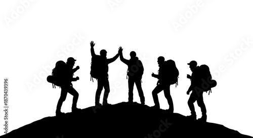 Silhouette of victorious hikers celebrating achievement on mountain summit top