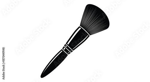 A striking black and white image of a makeup brush showcasing its elegant form silhouette
