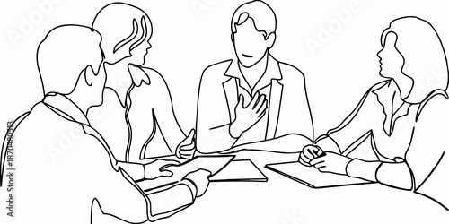 Four people in a meeting discussing ideas around a table