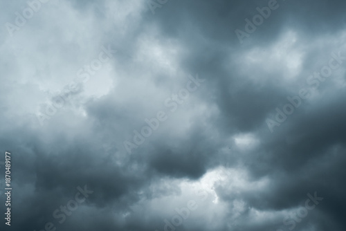 Dark storm clouds gathering in the sky, creating a dramatic and moody atmosphere that symbolizes approaching rain, weather change, and natural power