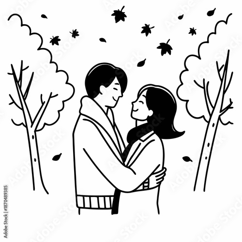 Close up of a beautiful young happy couple in love embracing while spending time in the autumn park