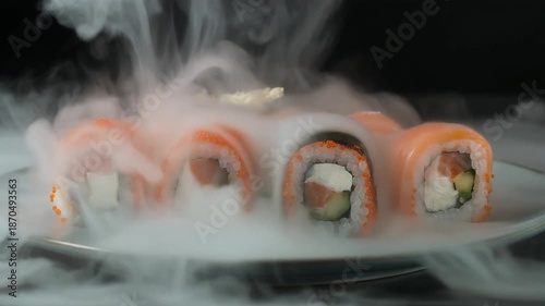 Sushi Rolls with Smoke on Plate.